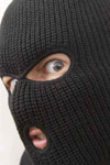 photo of a burglar wearing a ski mask